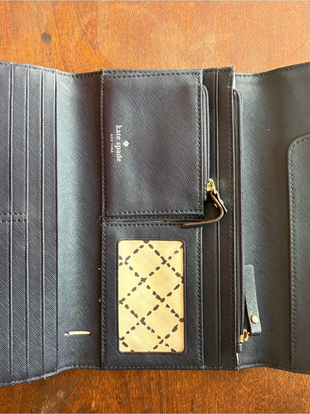 kate spade navy saffiano bifold wallet with gold logo plaque